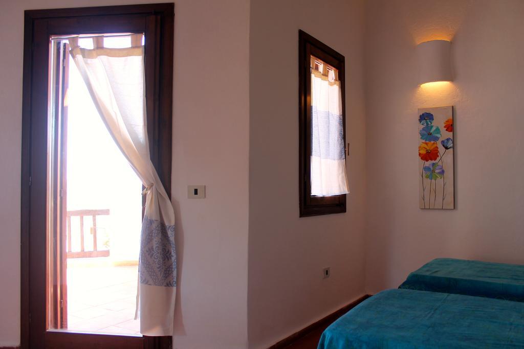 Апартаменты La Marmorata Vacation House Санта-Тереза-Галлура Номер фото